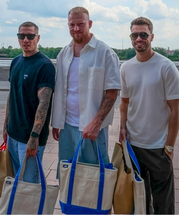 3 men wearing summer outfits and Lands' End tote bags