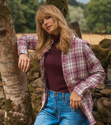 Woman wearing a premium pure linen tee styled with a skirt