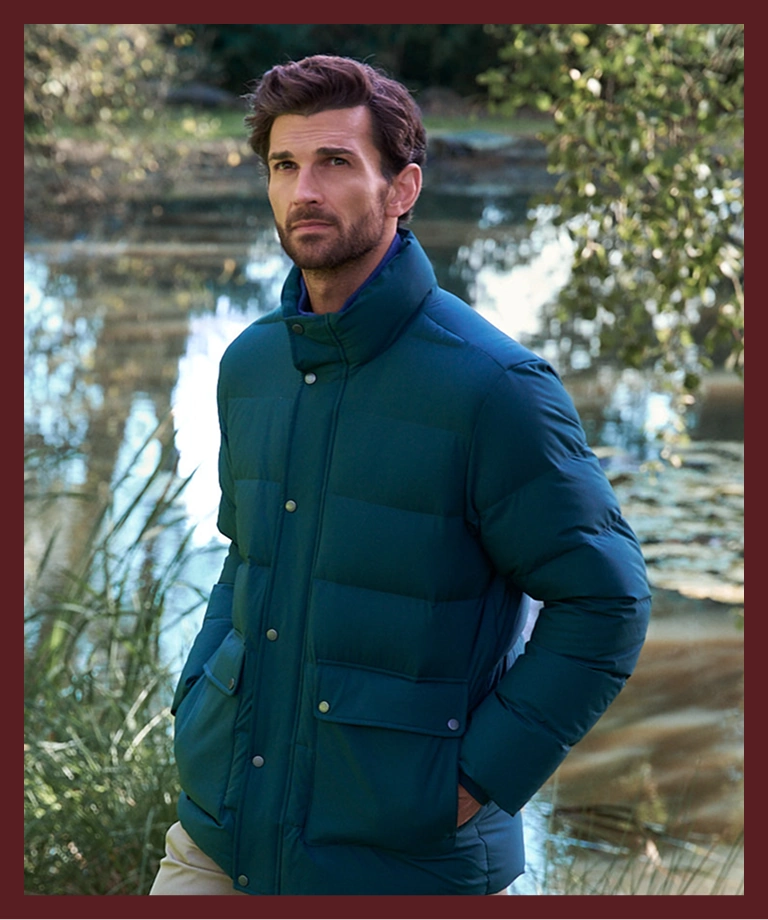 Man wearing a teal padded jacket